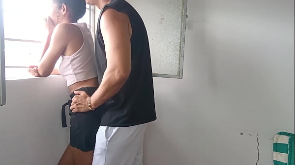 Fucking my stepsister next to the window being careful that the neighbors don't see us